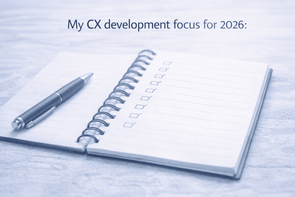 Open notebook with a pen placed on it, showing a checklist under the heading “My CX development focus for 2026:” with blank boxes and no items listed.