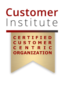Certification badge reading "Customer Institute: Certified Customer Centric Organization" on a gold ribbon.