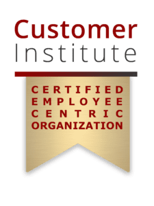 Logo with the text: "Customer Institute Certified Employee Centric Organization" on a gold ribbon with black and red lettering.